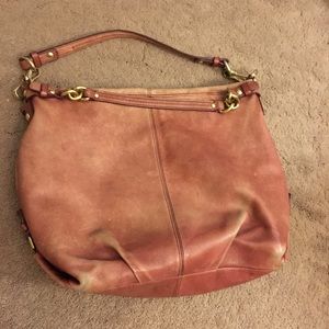 Pinkish coach purse with gold metal